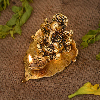 Rakhi combo - Ganesh diya, 2 rakhi and roli chawal box - Brass Daddy